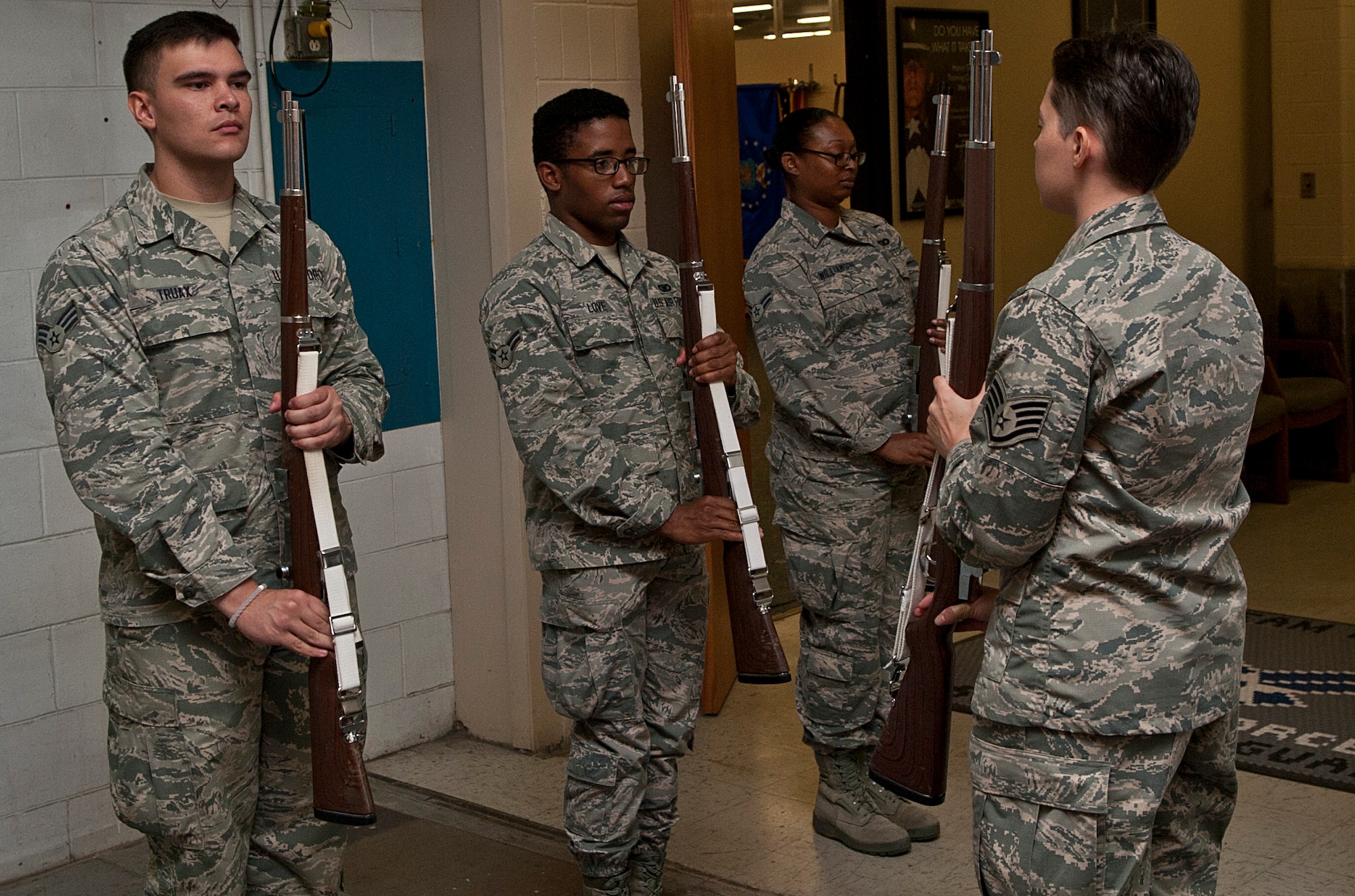 Airmen with the Minot Air Force Base Honor Guard practice with training rifles at Minot Air Force Base, N.D., Sept. 27, 2016. All Honor Guard Airmen must learn every aspect of honor guard training, from training in a color team to a drill team. (U.S. Air Force photo/Airman 1st Class Jonathan McElderry)