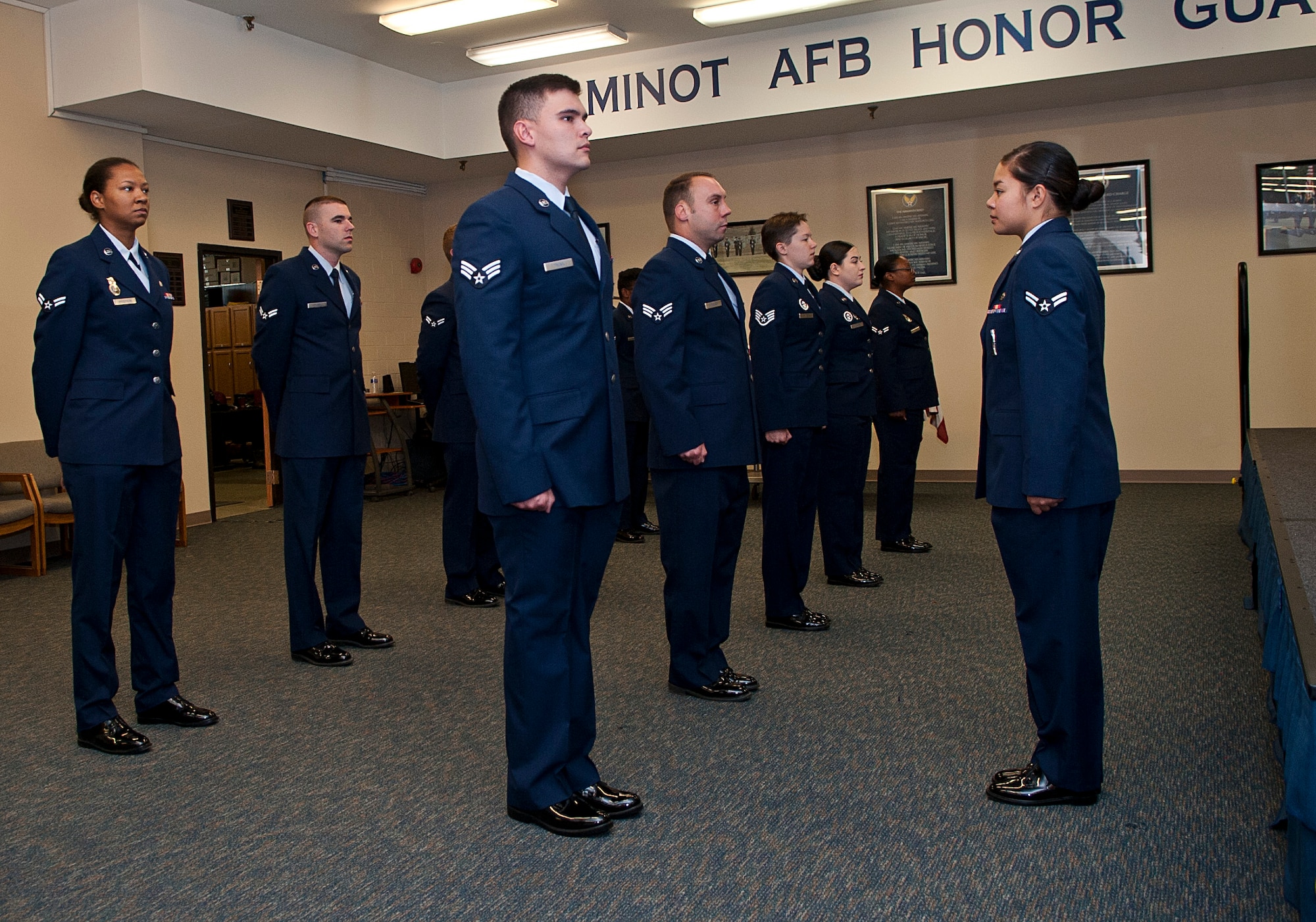 Airmen with the Minot Air Force Base Honor Guard perform an open ranks inspection at Minot Air Force Base, N.D., Sept. 29, 2016. Open ranks is performed in the Airmen’s service dress uniform in order to help them understand the dress and appearance standards of the ceremonial guardsmen, which must be upheld at all times. (U.S. Air Force photo/Airman 1st Class Jonathan McElderry)