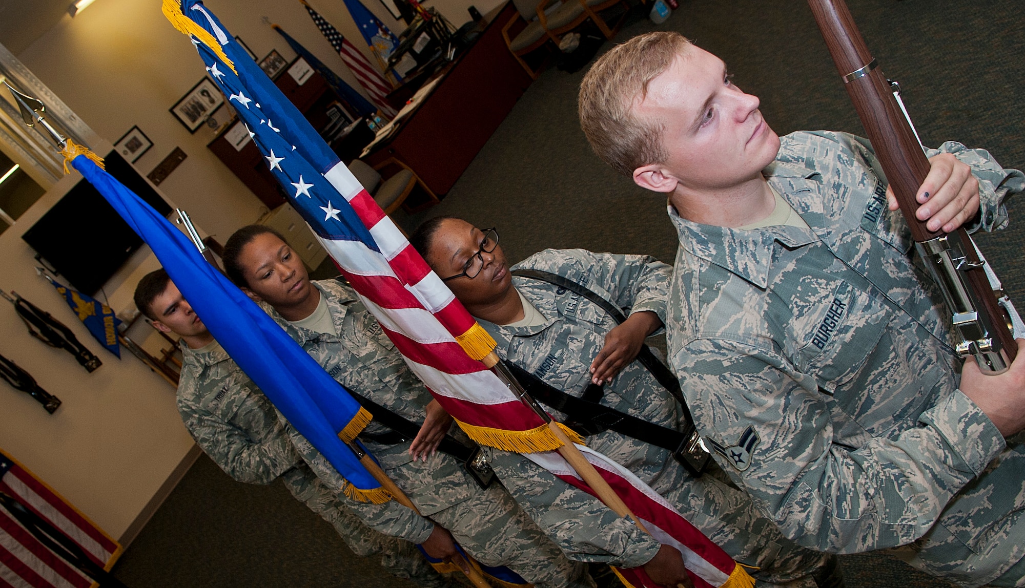 Airmen with the Minot Air Force Base Honor Guard go through color team training at Minot Air Force Base, N.D., Sept. 29, 2016. A color team is a four-Airman team which consists of Airmen carrying a lead rifle, the American flag, the Air Force flag and a trail rifle. (U.S. Air Force photo/Airman 1st Class Jonathan McElderry)