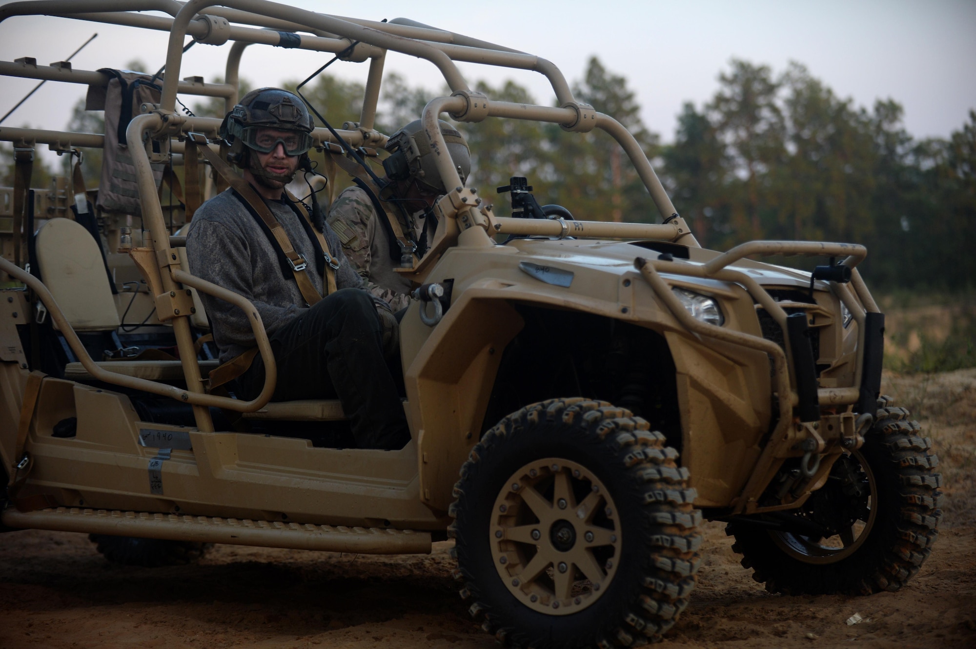 Jay Bennett, a journalist with Popular Mechanics, straps into a tactical vehicle Sept. 28, 2016, before night-time training with the 23rd Special Tactics Squadron.  (U.S. Air Force photo by Tech. Sgt. Jason Robertson)