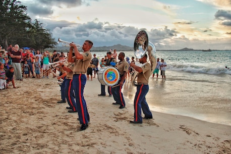 The MARFORPAC Brass Band performs in front of a crowd at Kailua Beach.