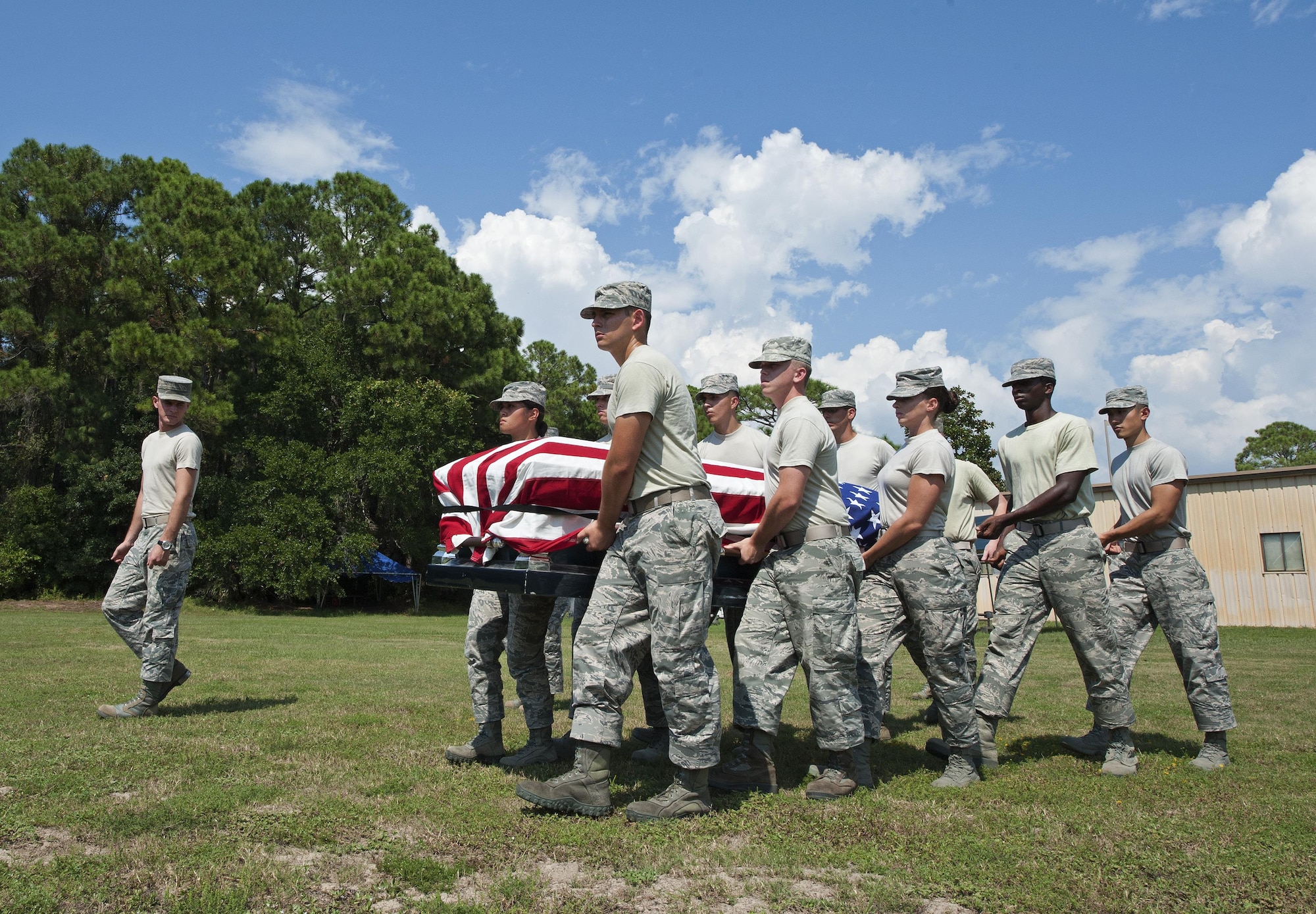 Honor guard trainees with the 1st Special Operations Force Support Squadron practice carrying a casket at Hurlburt Field, Fla., Sept. 28, 2016. Honor guard personnel train daily on ceremonial procedures. (U.S. Air Force photo by Senior Airman Andrea Posey)