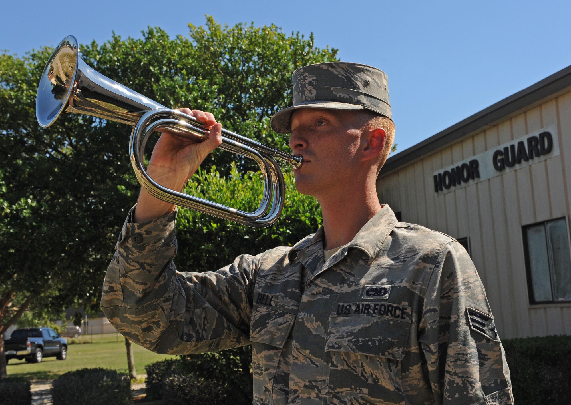 Senior Airman Michael Bell, an honor guard trainer with the 1st Special Operations Force Support Squadron, practices playing “Taps” on a bugle at Hurlburt Field, Fla., Sept. 29, 2016. “Taps” was composed by Army Maj. Gen. Daniel Butterfield during the Civil War and is used to honor service members during official ceremonies. (U.S. Air Force photo by Senior Airman Andrea Posey)