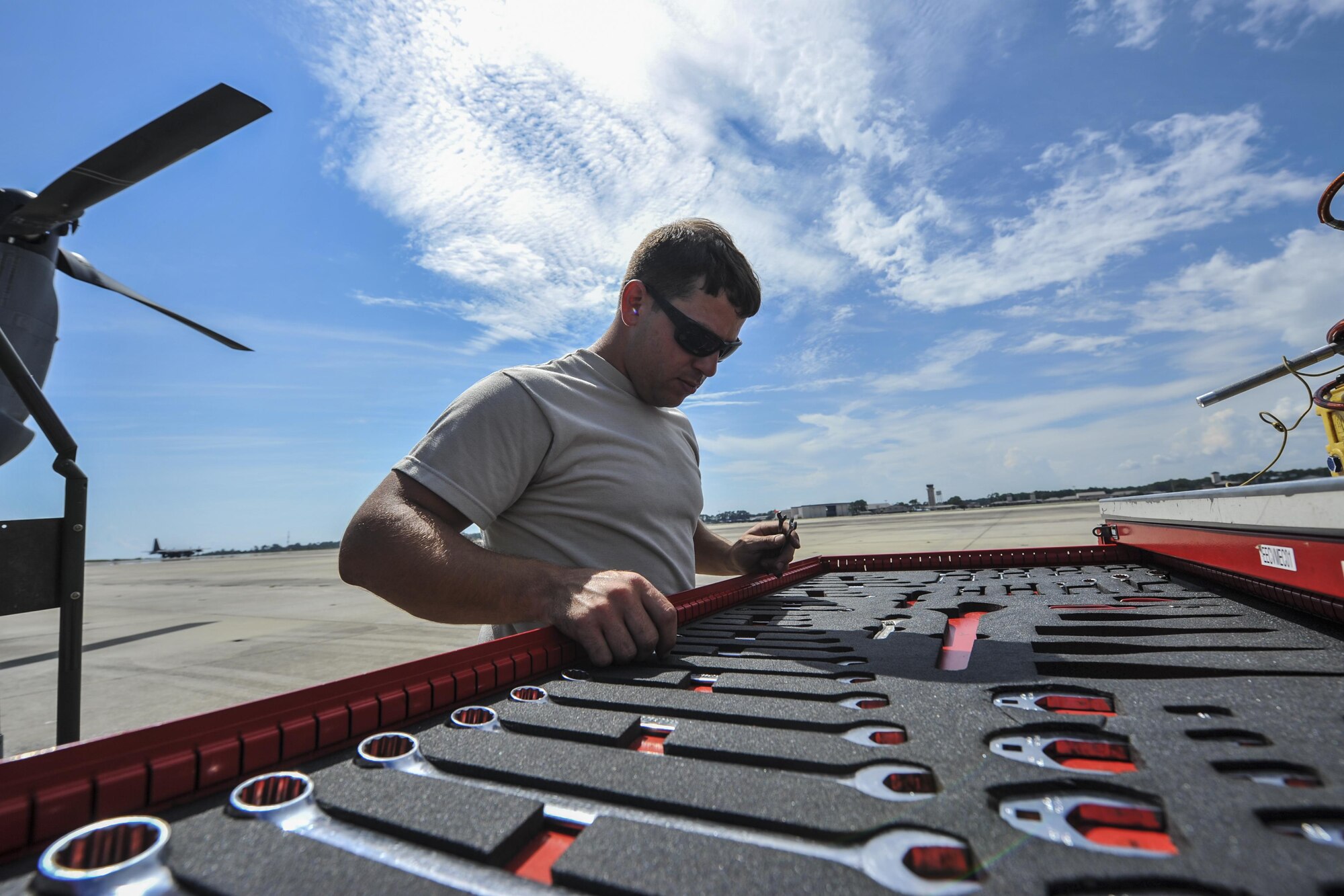 Airman 1st Class Curtis Masenheimer, a crew chief with the 801st Special Operations Aircraft Maintenance Squadron, gathers tools to perform maintenance on a CV-22 Osprey at Hurlburt Field, Fla., Sept. 27, 2016. Crew chiefs with the 801st SOAMXS are trained to diagnose malfunctions on the Osprey during pre and post-flight inspections, repair and refuel the aircraft, keep detailed records and ensure the aircraft are mission ready at all times. (U.S. Air Force photo by Airman 1st Class Joseph Pick)