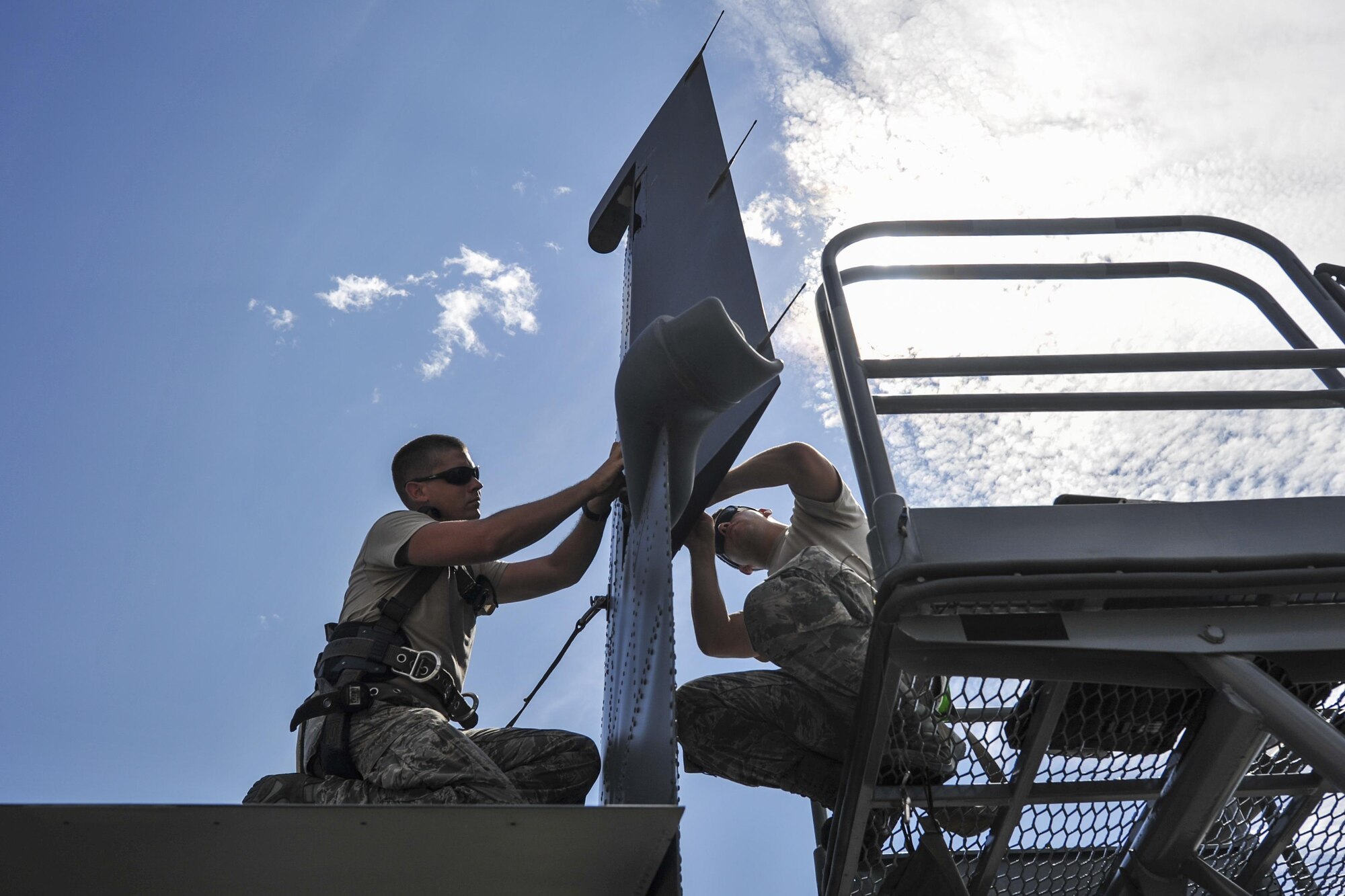 Staff Sgt. Jonathan Knutson, left, and Airman 1st Class Curtis Masenheimer, crew chiefs with the 801st Special Operations Aircraft Maintenance Squadron, perform maintenance on the tail of a CV-22 Osprey at Hurlburt Field, Fla., Sept. 27, 2016. Crew chiefs with the 801st SOAMXS are trained to diagnose malfunctions on the Osprey during pre and post-flight inspections, repair and refuel the aircraft, keep detailed records and ensure the aircraft are mission ready at all times. (U.S. Air Force photo by Airman 1st Class Joseph Pick)