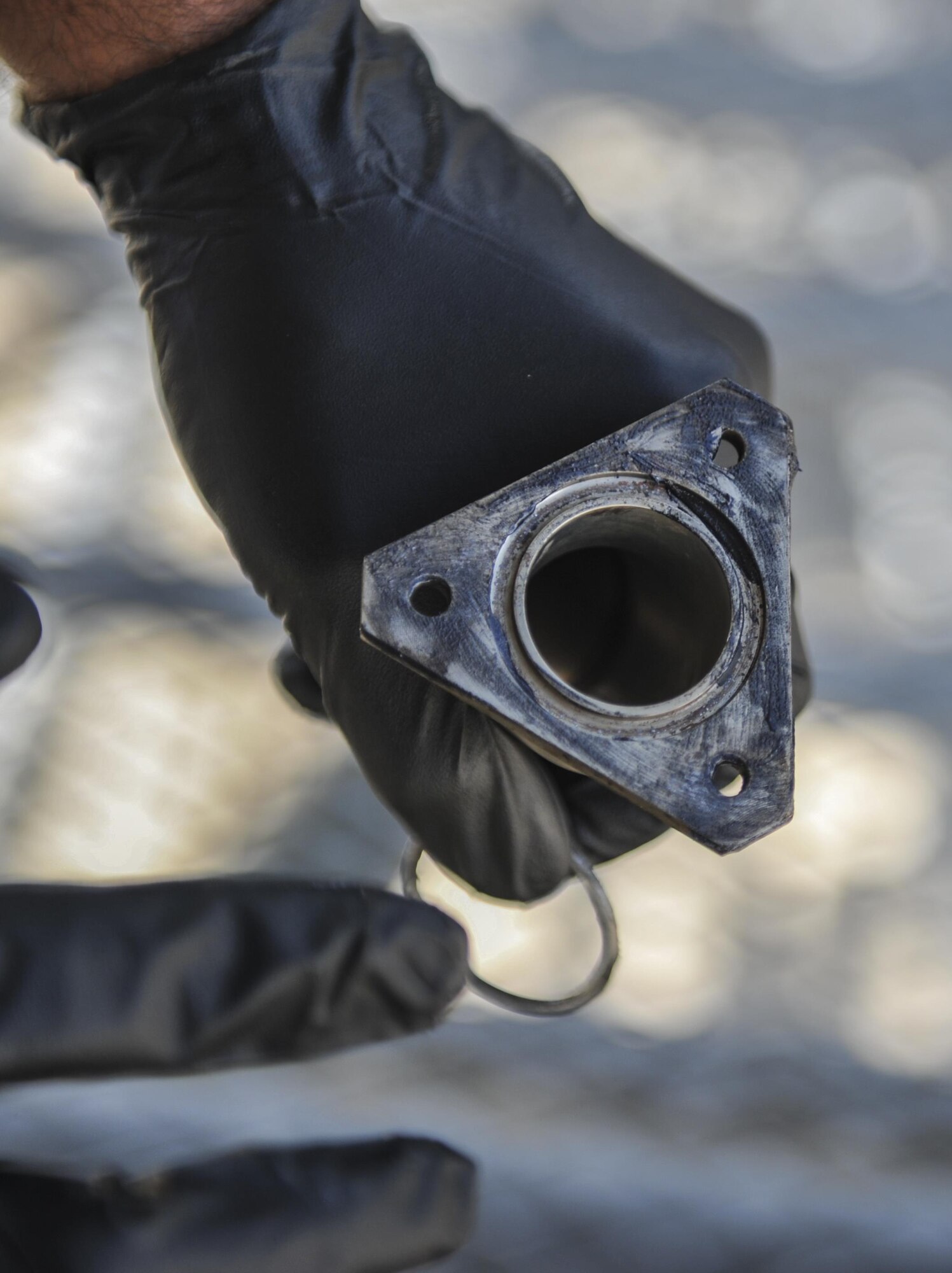 Staff Sgt. Dane Devlin, a crew chief with the 801st Special Operations Aircraft Maintenance Squadron, greases an engine part for a CV-22 Osprey at Hurlburt Field, Fla., Sept. 27, 2016. The Osprey is a tiltrotor aircraft that combines the vertical takeoff, hover and vertical landing characteristics of a helicopter with the long-range, fuel efficiency and speed characteristics of a turboprop aircraft. (U.S. Air Force photo by Airman 1st Class Joseph Pick)