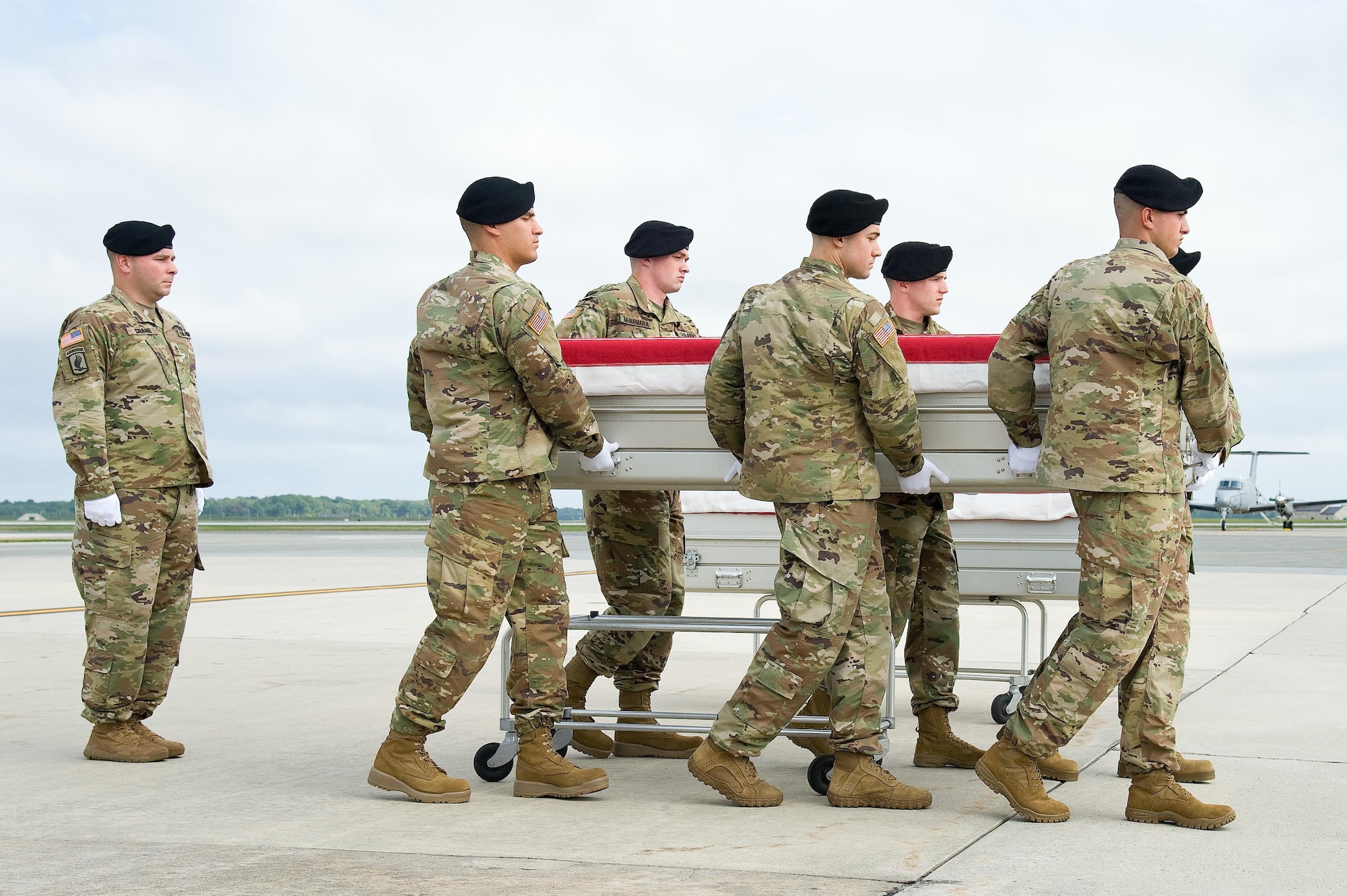 In a Repatriation of Remains event, Air Force Mortuary Affairs Operations personnel and a U.S. Army carry team transfer the remains of what is believed to be the remains of Americans from a C-12 Huron aircraft during a dignified transfer Sept. 28, 2016, at Dover Air Force Base, Del. Thirteen sets of remains believed to be of Soldiers who died during the Battle of Monterrey, Mexico in 1846 during the Mexican-American War, were returned to the U.S. for forensic processing by Armed Forces Medical Examiner System. (U.S. Air Force photo by Roland Balik)