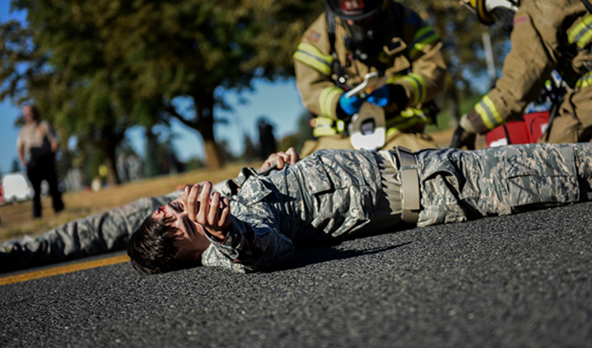 A Team Fairchild Airman plays as a victim of a vehicle crash during an Emergency Management Exercise Sept. 27, 2016, at Fairchild Air Force Base, Wash. One of the primary goals of the 92nd Air Refueling Wing and 141st ARW Inspector General office is to make all of the exercises conducted on base as realistic as possible. (U.S. Air Force photo/Airman 1st Class Sean Campbell)
