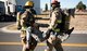 A pair of Team Fairchild firefighters carry an unconscious Airman away from the scene of an accident during an Emergency Management Exercise Sept. 29, 2016, at Fairchild Air Force Base, Wash. Multiple casualties allow Airmen to gain experience during these exercises. (U.S. Air Force photo/Airman 1st Class Ryan Lackey)