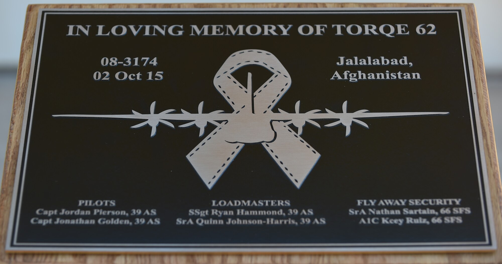A plaque memorializing the Airmen of TORQE 62 was unveiled at Dyess Air Force Base, Texas, Sept. 30, 2016. The plaque is scheduled to be added to the Dyess Memorial Park upon its completion. (U.S. Air Force photo by Airman 1st Class Quay Drawdy)