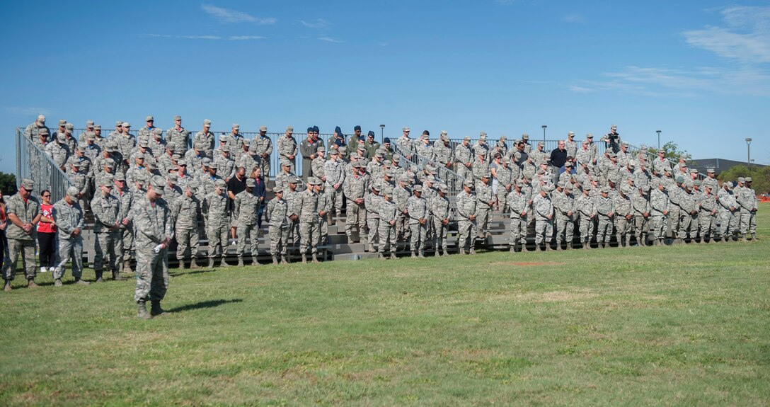 U.S. Air Force Airmen across Dyess Air Force Base bow their heads during the opening prayer of the TORQE 62 memorial ceremony at Dyess Air Force Base, Texas, Sept. 30, 2016. At the end of the ceremony, there was a 62-second moment of silence to honor the fallen Airmen of TORQE 62. (U.S. Air Force photo by Airman 1st Class Rebecca Van Syoc)