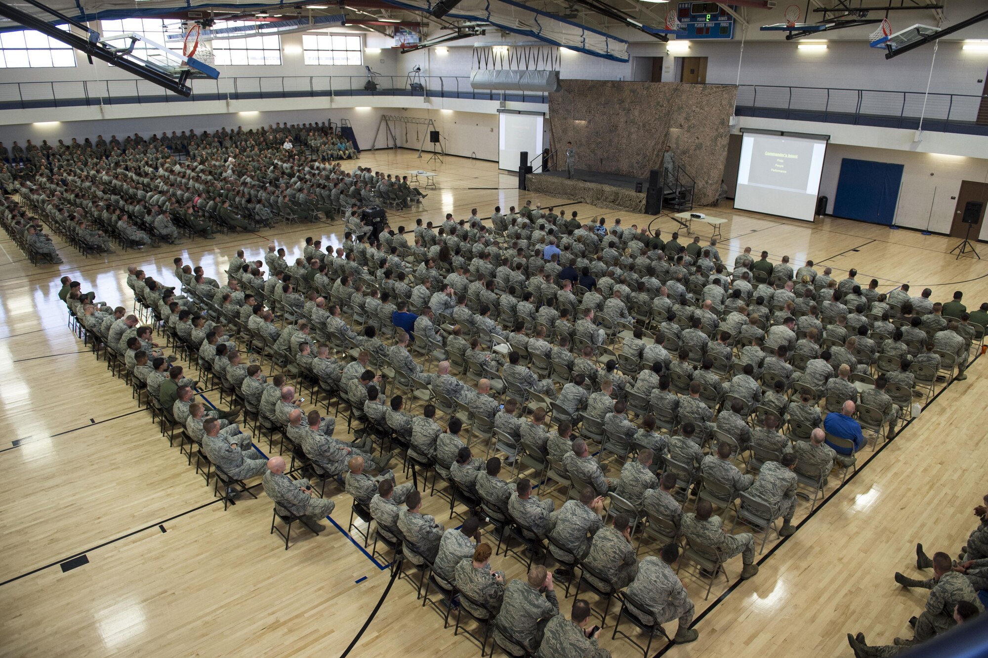 Holloman Airmen listen to Col. Houston Cantwell, the 49th Wing commander, deliver his first commander’s call at Holloman Air Force Base, N.M., on Sept. 29. Cantwell discussed various topics with the Airmen from his first impressions to the importance of the RPA mission here. (U.S. Air Force photo by Senior Airman Aaron Montoya)