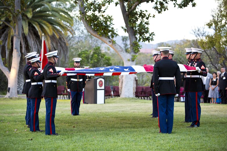 U. S. Marines with Marine Corps Installations West, Marine Corps Base Camp Pendleton, fold the American flag during the commanding general’s evening colors ceremony at the historic Santa Margarita Ranch House on Camp Pendleton, Calif., Sept. 28, 2016. (U.S. Marine Corps photo by Sgt. Tabitha A. Markovich)