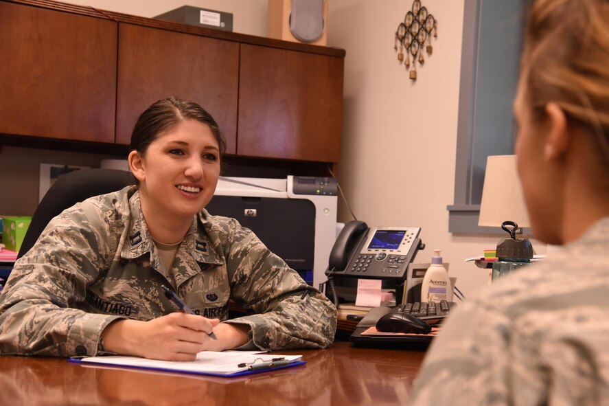 Capt. Catherine Santiago, Air Force Legal Operations Special Victims’ Counsel attorney, speaks with a client at the base legal office Sept. 30, 2016, at Malmstrom Air Force Base, Mont. Santiago is Malmstrom’s first SVC attorney, and helps victims of sexual assault through the military justice program. (U.S. Air Force photo/Senior Airman Jaeda Tookes)