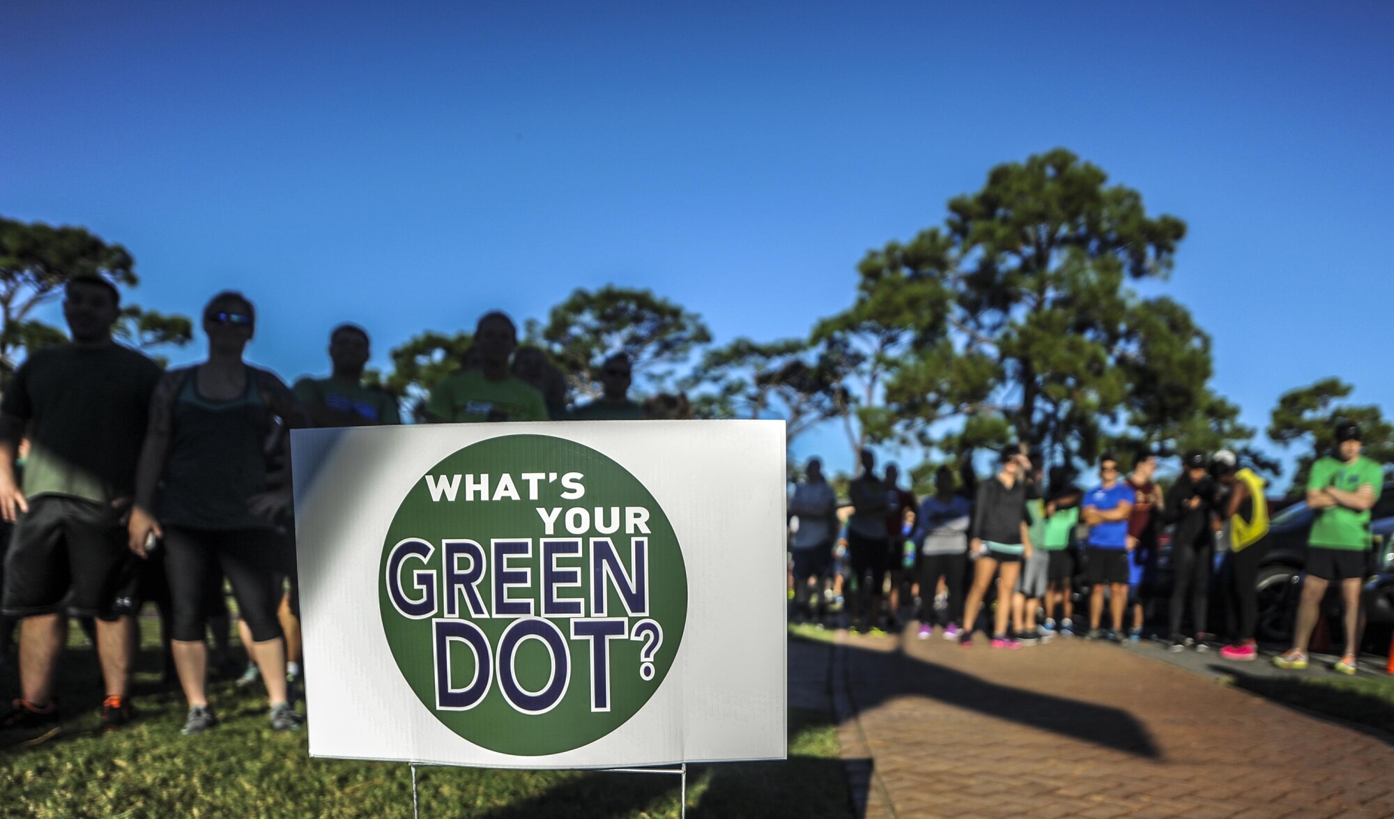 Air Commandos prepare to run in the Green Dot 5k run at Hurlburt Field, Fla., Sept. 30, 2016. Green Dot is an initiative to reduce power-based interpersonal violence, which includes sexual, child abuse and bullying. (U.S. Air Force photo by Airman 1st Class Isaac O. Guest IV)