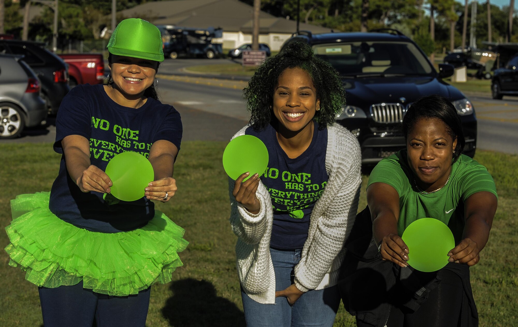 Green Dot advocates pose with the organization’s symbol during the Green Dot 5k run at Hurlburt Field, Fla., Sept. 30, 2016. The Green Dot symbol symbolizes the strategy of preventing power-based interpersonal violence including sexual violence, dating violence and stalking. (U.S. Air Force photo by Airman 1st Class Isaac O. Guest IV)