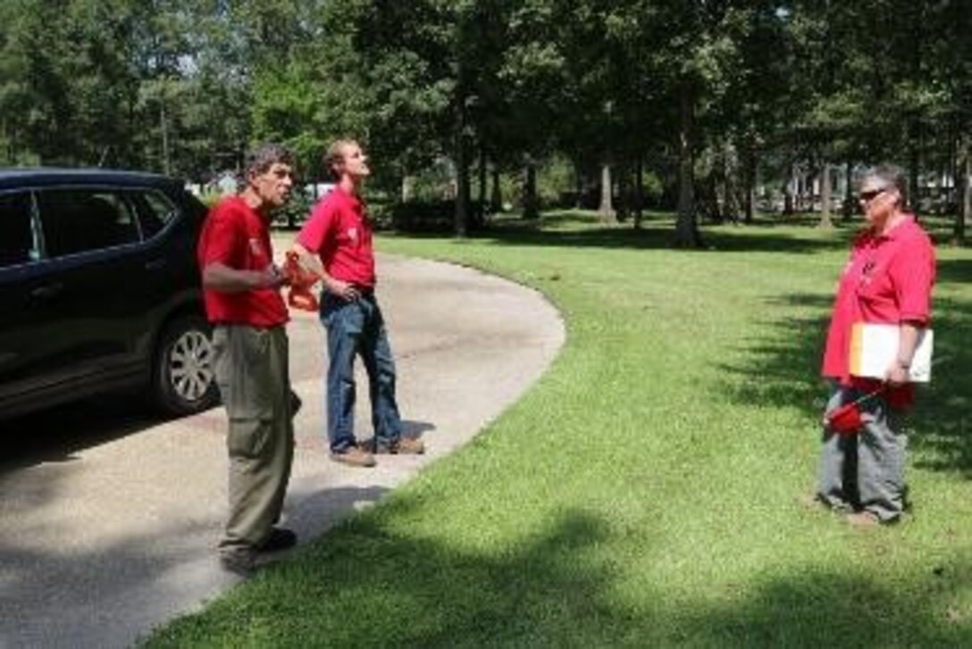 Larry McIntosh (L), John Nevels (C) and Sheron Belcher (R), quality assurance representatives, discuss the possible location of a Manufactured Housing Unit during a site inspection.  These Corps employees from the Huntsville Center are in southern Louisiana supporting the Federal Emergency Management Agency's temporary housing mission that stemmed from the Baton Rouge flood.

