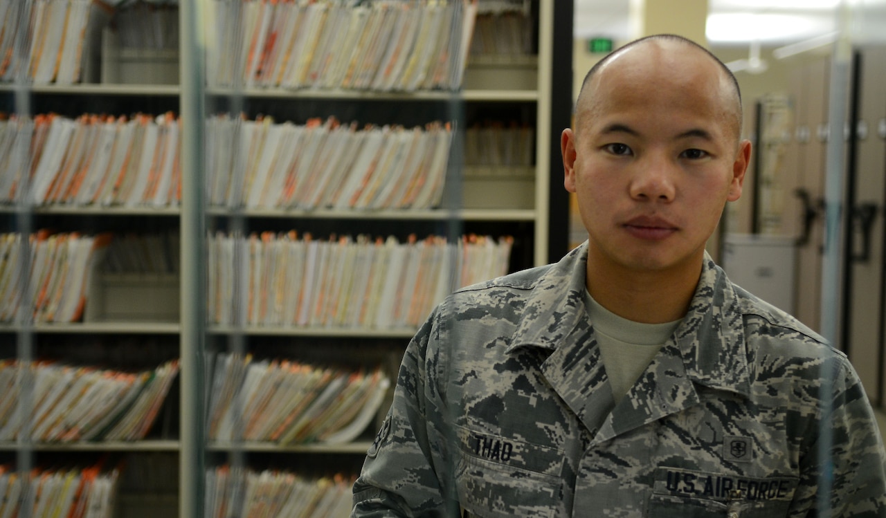 Airman 1st Class Seng Thao, a medical records technician assigned to the 6th Medical Support Squadron, prepares to assist a customer Sept. 15, 2016, at MacDill Air Force Base Fla. Thao ensures medical records are accurate, enabling Airmen to be deployment ready to support any mission. (U.S. Air Force photo by Airman 1st Class Rito Smith) 
