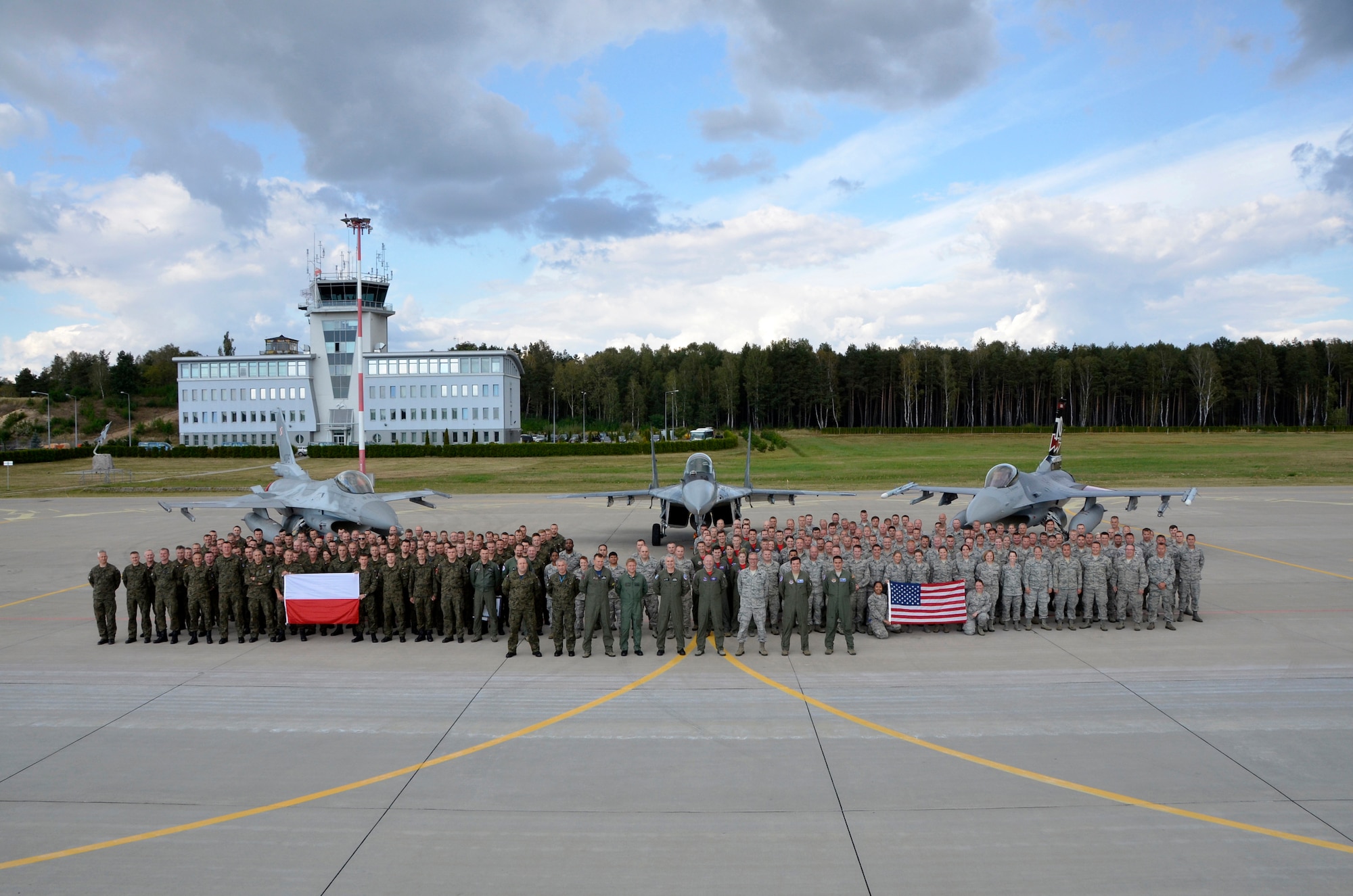Members of the South Dakota Air National Guard, 52nd Operations Group Detachment 1, and the Polish air force, stand for a group photo at Lask Air Base, Poland, Sept. 22, 2016. The 114th Fighter Wing deployed more than 100 personnel in support of Aviation Detachment 16-4, a bilateral training exercise between the U.S. and Polish forces. The 114 FW was able to train alongside Polish allies in a variety of missions to include, close air support, air to air and air to ground. (U.S. Air National Guard photo by Capt. Amy Rittberger)