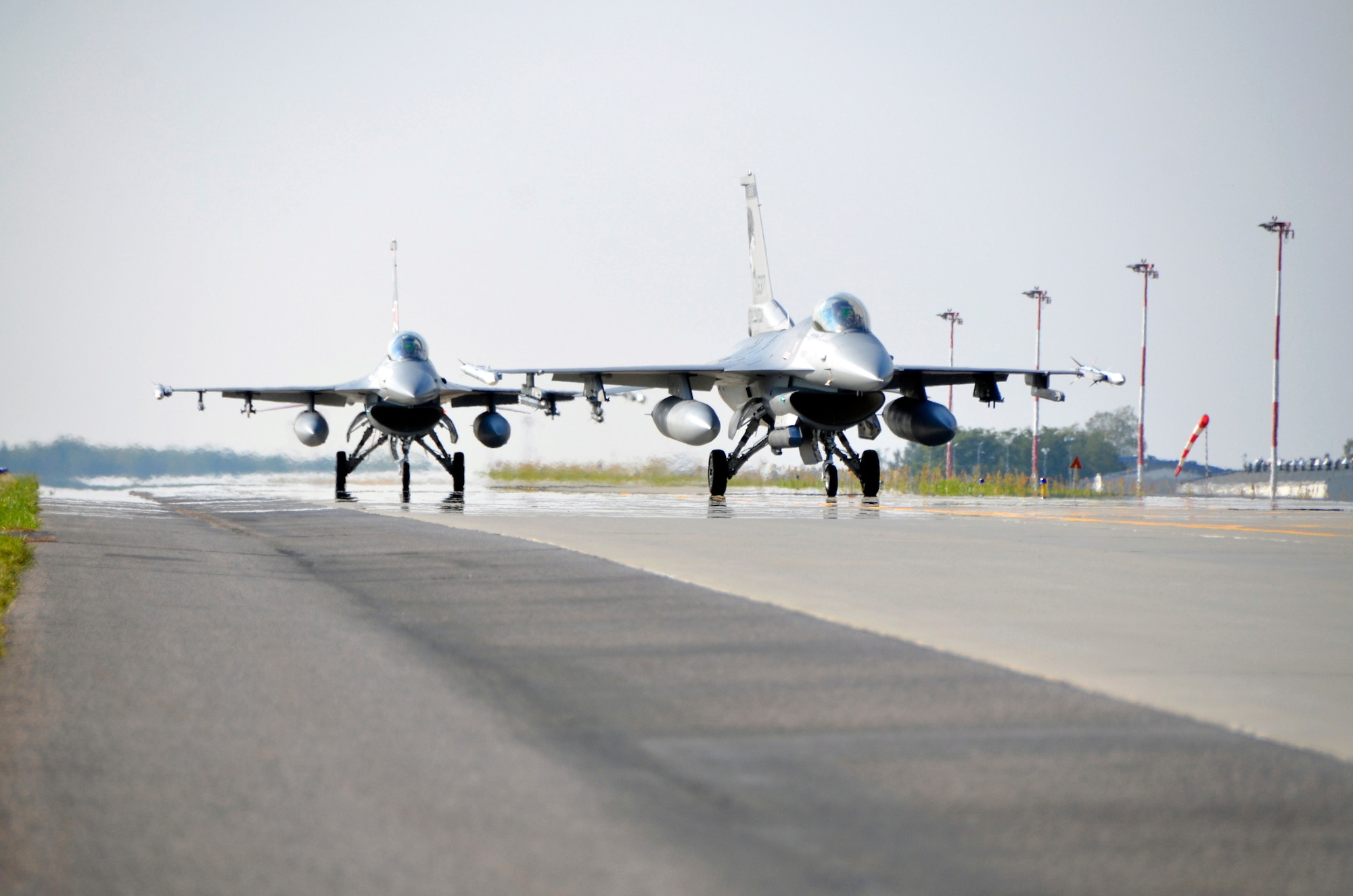 Two F-16 Fighting Falcons from the South Dakota Air National Guard arrive at Lask Air Base, Poland, Sept. 19, 2016, after completing a training mission. The 114th Fighter Wing deployed more than 100 personnel in support of Aviation Detachment 16-4, a bilateral training exercise between the U.S. and Polish forces. The 114 FW was able to train alongside Polish allies in a variety of missions to include, close air support, air to air and air to ground. (U.S. Air National Guard photo by Capt. Amy Rittberger)