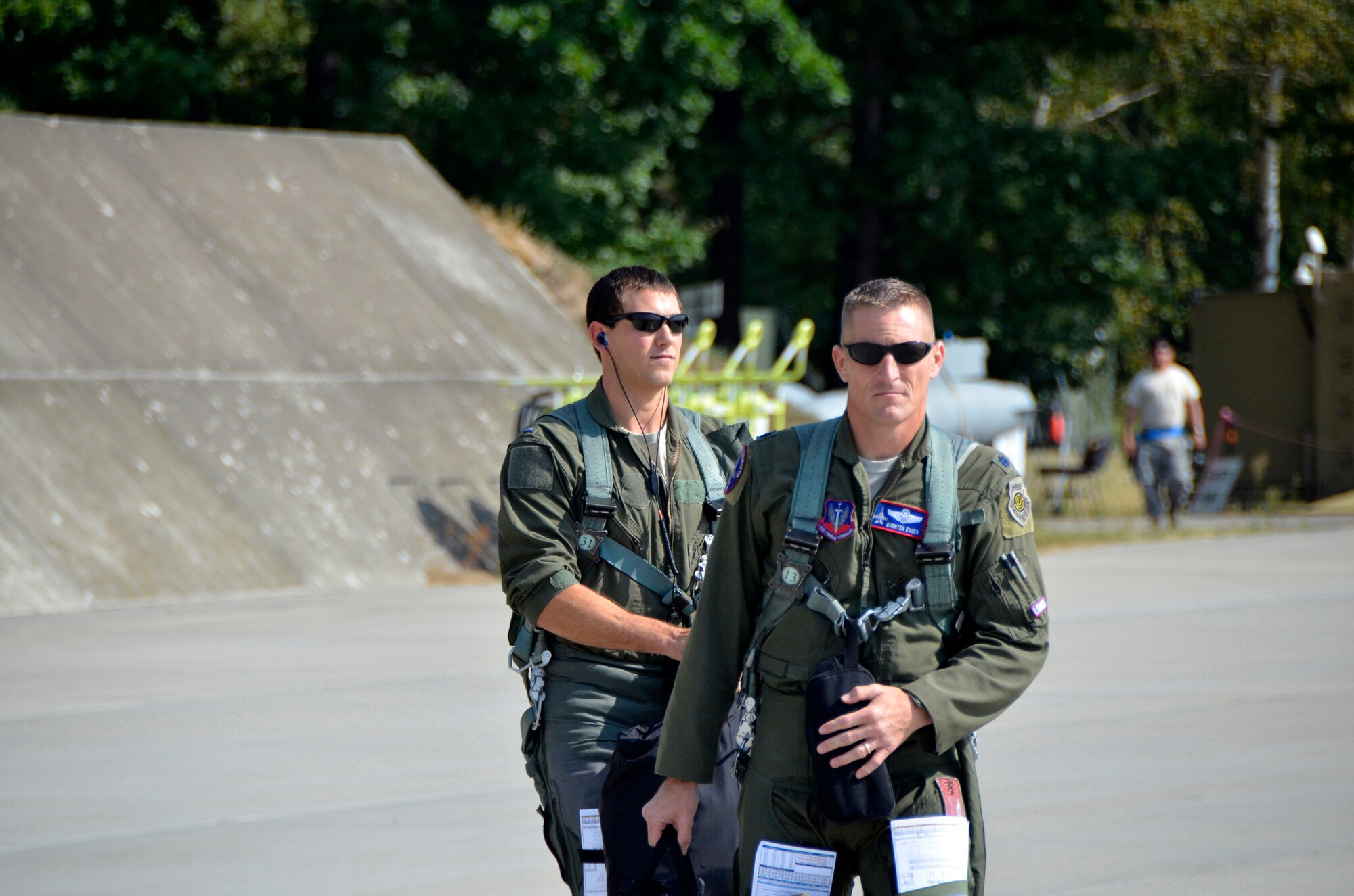 Lt. Col. Quenten Esser, 114th Operations Group commander, and 1st Lt. Brendan Zubrod, F-16 wingman and assistant chief of weapons and tactics, step to their jets prior to a training mission at Lask Air Base, Poland, Sept. 12, 2016. The 114th Fighter Wing deployed more than 100 personnel in support of Aviation Detachment 16-4, a bilateral training exercise between the U.S. and Polish forces. The 114 FW was able to train alongside Polish allies in a variety of missions to include, close air support, air to air and air to ground. (U.S. Air National Guard photo by Capt. Amy Rittberger)