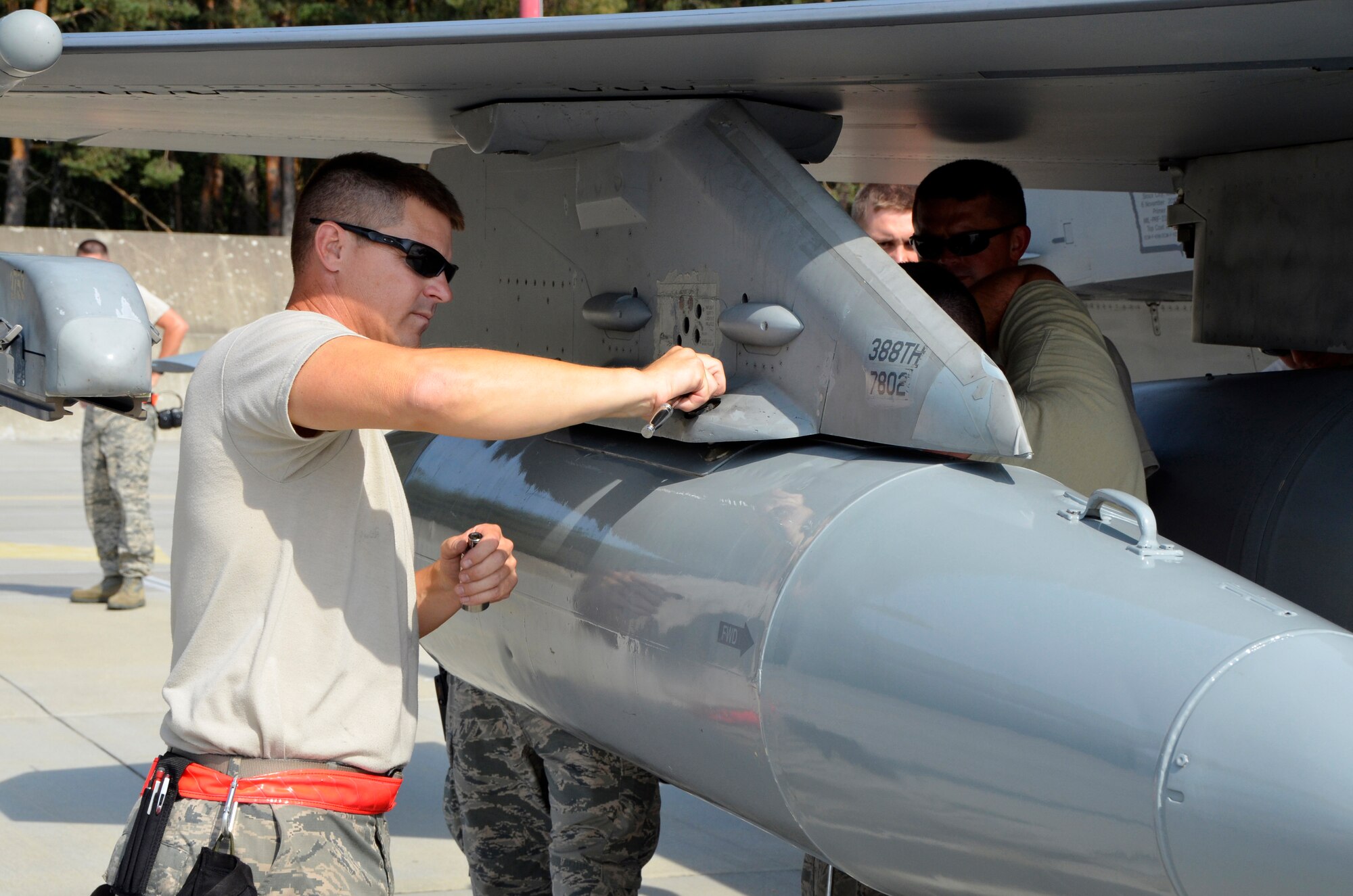 Master Sgt. Scott Meyer, 114th Aircraft Maintenance Squadron crew chief, removes a travel pod from an F-16 Fighting Falcon after arrival at Lask Air Base, Poland, Sept. 3, 2016. The 114th Fighter Wing deployed more than 100 personnel in support of Aviation Detachment 16-4, a bilateral training exercise between the U.S. and Polish forces. The 114 FW was able to train alongside Polish allies in a variety of missions to include, close air support, air to air and air to ground. (U.S. Air National Guard photo by Capt. Amy Rittberger)