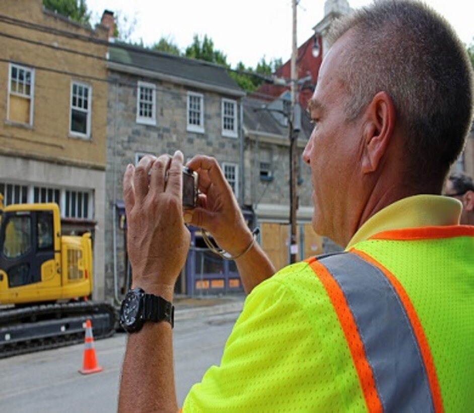 Steve O'Leary, U.S. Army Corps of Engineers, Huntington District architect, documents flood damage in Ellicott City, Maryland, Sept. 20, 2016. Ellicott City suffered a major flood in July 2016. O'Leary is a member of the USACE National Nonstructural Flood Proofing Committee that assists communities nationwide with nonstructural flood-risk management. Examples of nonstructural measures include elevation and waterproofing of buildings, moving valuables to higher locations and flood-emergency preparedness. (U.S. Army photo by Sarah Gross)