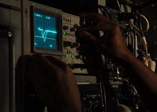U.S. Air Force Senior Airman Darrin Brewer, a ground radar systems technician with the 727th Expeditionary Air Control Squadron Detachment 3, ensures that a radar system is functioning correctly at Al Udeid Air Base, Qatar, March 31, 2017. The Airmen with the 727th EACS Det. 3 are responsible for maintaining and operating ground radar systems and ensure that they are operational at all times. (U.S. Air Force photo by Senior Airman Miles Wilson)
