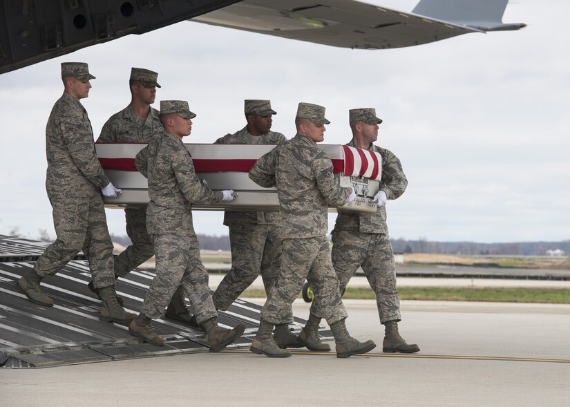 A U.S. Air Force carry team transfers the remains of Staff Sgt. Austin Bieren, of Umatilla, Ore., April 1, 2017, at Dover Air Force Base, Del. Bieren was assigned to the 21st Space Wing, Peterson AFB, Colo. (U.S. Air Force photo by Senior Airman Zachary Cacicia)