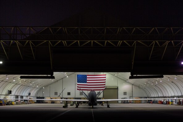 380th Air Expeditionary Wing EQ-4 Global Hawks await routine maintenance before completing sorties in support of Combined Joint Task Force-Operation Inherent Resolve at an undisclosed location in Southwest Asia, March 31, 2017. (U.S. Air Force/Senior Airman Tyler Woodward)