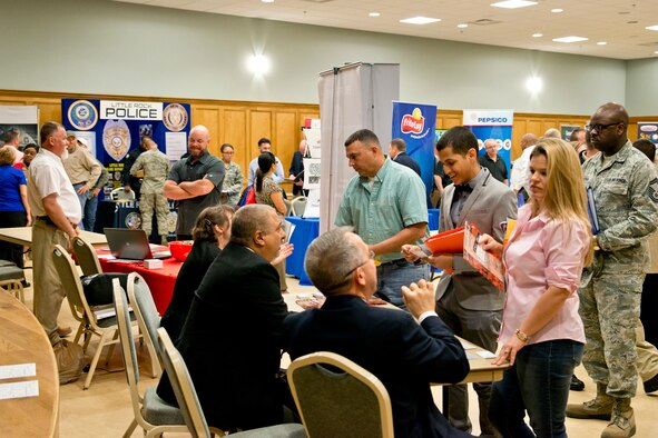 Job seekers speak with FBI representatives at the Military Hiring Fair held in the Walters Community Support Center March 30, 2017, at Little Rock Air Force Base, Ark. The event was open to current and former military members and their spouses and gave prospective employees an opportunity to make a first impression with recruiters from the local area and beyond. (U.S. Air Force photo by Master Sgt. Jeff Walston/Released)