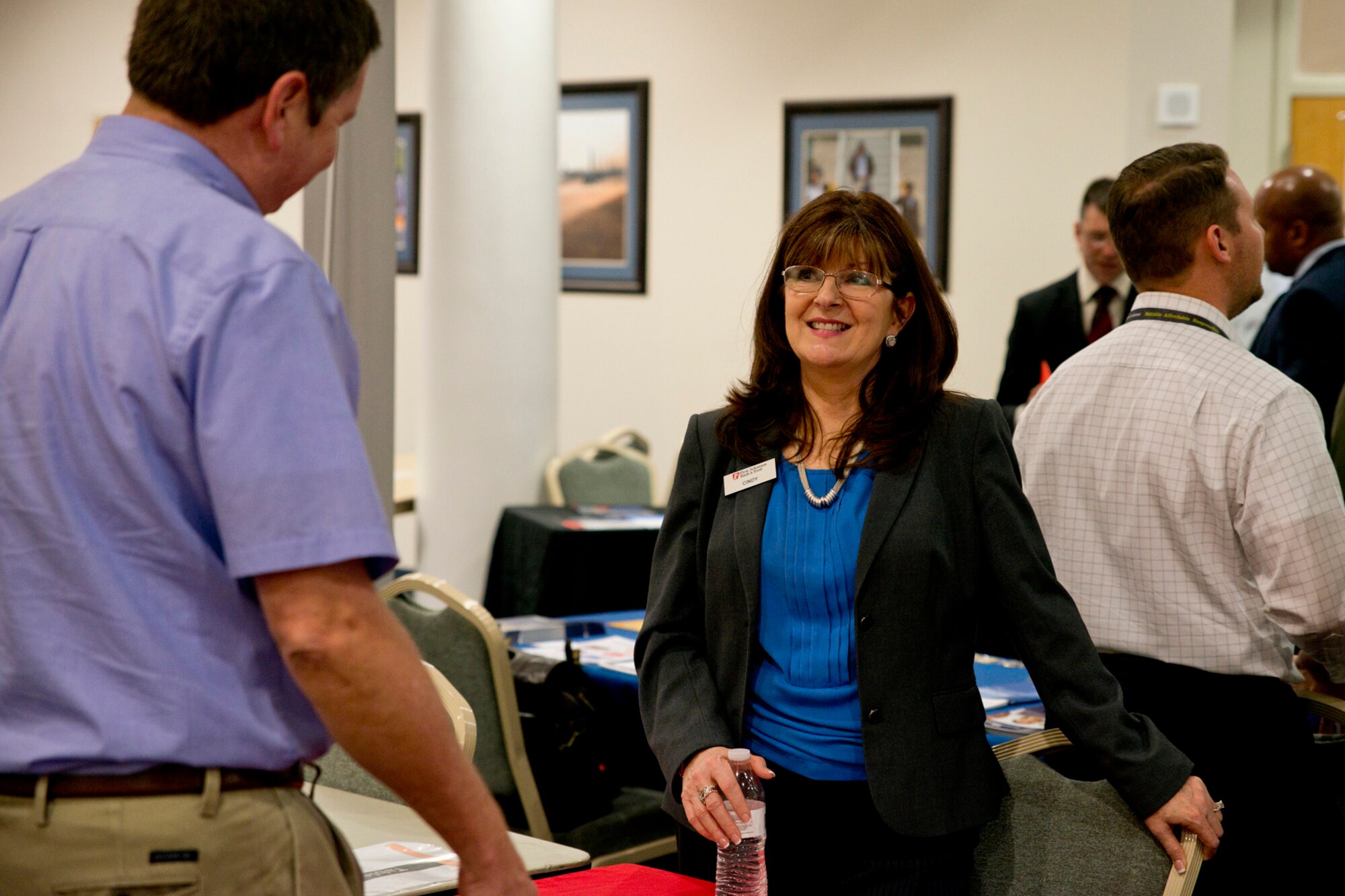 Cindy Wheeler, human resources benefits administrator, First Arkansas Bank & Trust, speaks with a job seeker at the Military Hiring Fair held in the Walters Community Support Center March 30, 2017, at Little Rock Air Force Base, Ark. Human Resource Recruiters from FAB&T joined approximately 100 recruiters from more than 70 businesses looking for prospective employees to fill for positions from all over the area. (U.S. Air Force photo by Master Sgt. Jeff Walston/Released)