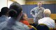 Chaplain (Maj.) John Rollyson speaks with a small congregation during the Unit Training Assembly’s chapel service April 2 at Duke Field, Fla.  The 919th Special Operations Wing’s chaplains visit all of the wing’s units quarterly to meet and talk with Airmen to let them know their spiritual and counseling services are available should the need arise.  (U.S. Air Force photo/Tech. Sgt. Sam King)