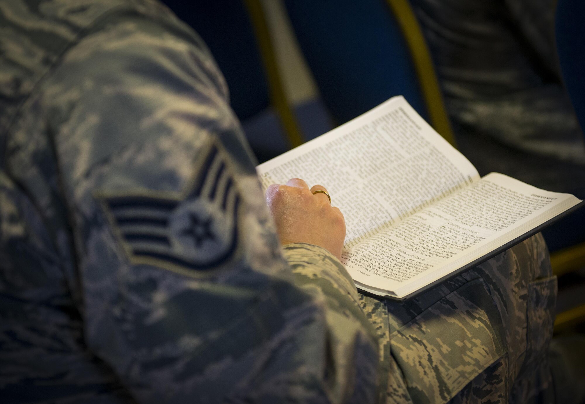 An Airman follows along with the scripture being read during the Unit Training Assembly’s chapel service April 2 at Duke Field, Fla.  The 919th Special Operations Wing’s chaplains visit all of the wing’s units quarterly to meet and talk with Airmen to let them know their spiritual and counseling services are available should the need arise.  (U.S. Air Force photo/Tech. Sgt. Sam King)