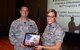 Col. Frank Amodeo 927th Air Refueling Wing commander presents Lt. Col. Meredith Seeley, 927th Logistics Readiness Squadron commander, with an award for her squadron at Commander’s call held at MacDill Air Force Base, FL during Saturday of the April Unit Training Assembly. Amodeo began the event by presenting wing awards to members of the 927 ARW. (U.S. Air Force photo by Staff Sgt. Xavier Lockley)