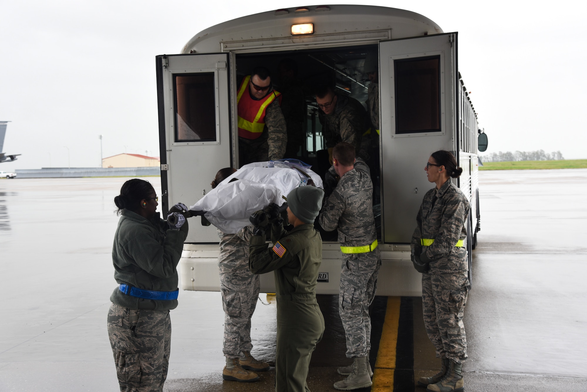 An aeromedical evacuation team litter carries a simulated patient at Travis Air Force Base, Calif., March 24, 2017. This scenario took place the first day of the two-day aeromedical evacuation training exercise, Patriot Delta. (U.S. Air Force photo by Senior Airman Sam Salopek)