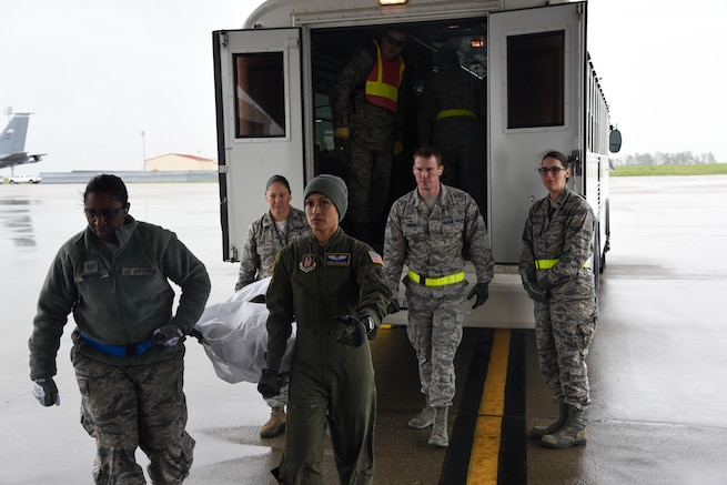 An aeromedical evacuation teams litter carries a simulated patient at Travis Air Force Base, Calif., March 24, 2017. This scenario took place the first day of the two-day aeromedical evacuation training exercise, Patriot Delta. (U.S. Air Force photo by Senior Airman Sam Salopek)
