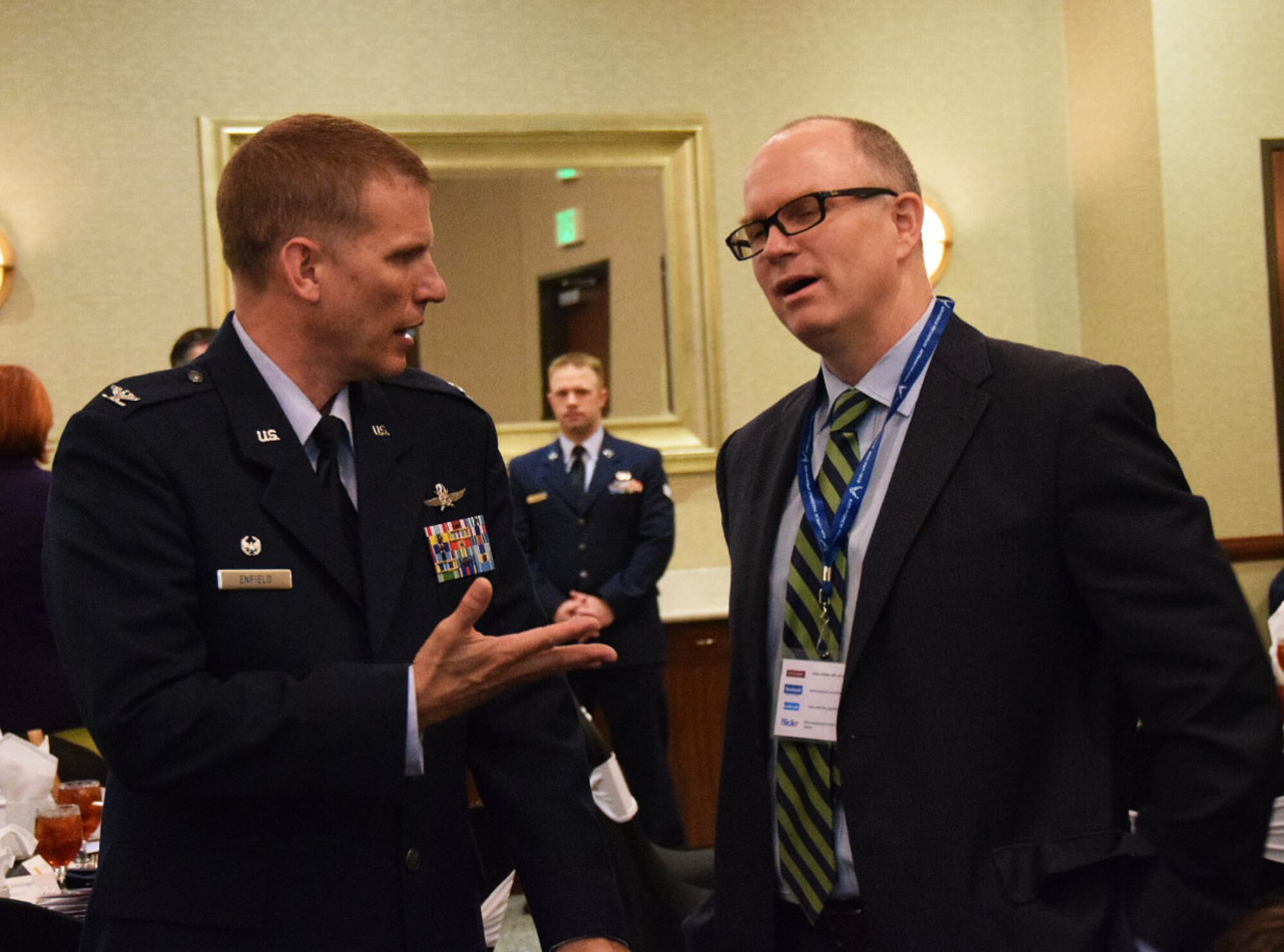 Col. David W. Enfield, 433rd Mission Support Group commander (left) talks with Clay Richmond, vice president of JSWC, Ltd., prior to the Honorary Commanders induction ceremony April 1, 2017 in San Antonio, Texas. The wing welcomed 16 new honorary commanders into the program. U.S. Air Force photo by Tech. Sgt. Carlos J. Treviño)