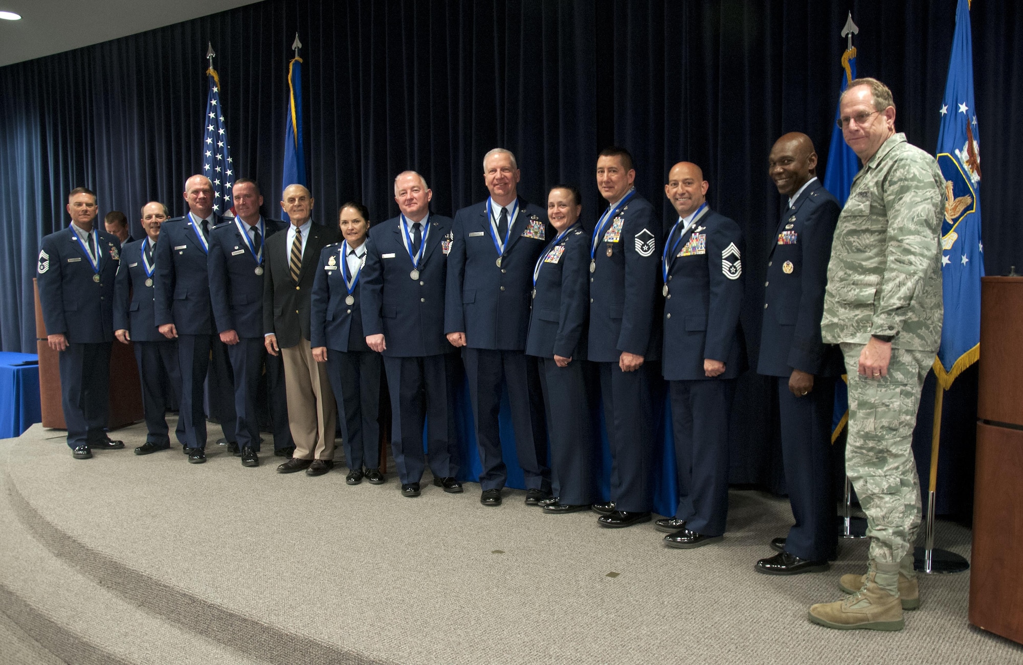 Ten long-serving members of the Nevada National Guard received recognition Sunday for their decades of service. (from left to right) Chief Master Sgt. Mark Prizina, Chief Master Sgt. Lorne Hall, Col. Glen Martel, Col. Dave Manson, 
Major Gen. Drennan A. Clark (ret.), Lt. Col. Shelly Assiff, Senior Master Sgt. Steve Graham, Chief Master Sgt. William Moore, Col. JoAnn Meacham, Master Sgt. Paul Hinen, Chief Master Sgt. Tim Broadway, Assistant Adjutant General, Brig. Gen. Ondra Berry, and The Adjutant General, Brig. Gen. William Burks. Retired Maj. Gen. Drennan A. Clark, former adjutant general of Nevada, helped present the awards, which bear his name, “The Drennan A. Clark Order of Nevada,” during a ceremony at the Air National Guard base here.