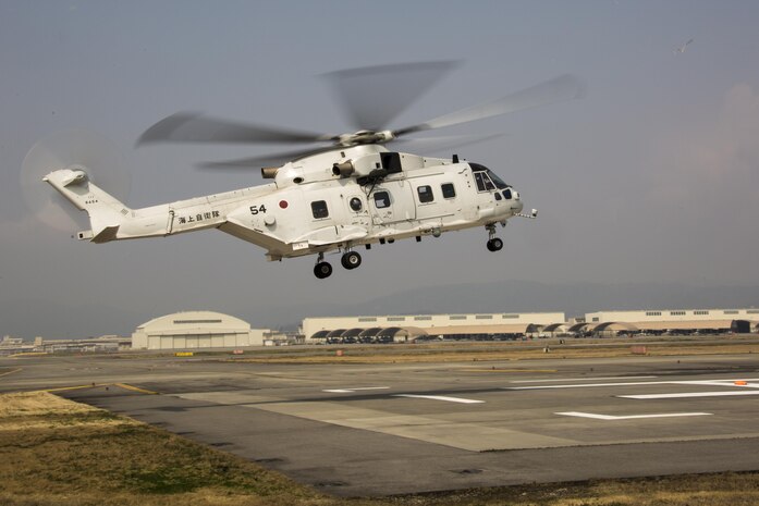 A Japanese MCH-101 airborne mine countermeasures helicopter lands on a heliport designated by Marine Air Control Squadron (MACS) 4 Detachment B during a cross-training exercise at Marine Corps Air Station Iwakuni, Japan, March 30, 2017. The purpose of the exercise was to simulate a forward arming and refueling points operation, where Marines communicated with Japan Maritime Self-Defense Force helicopter pilots to perform austere landings on a heliport that acted as an expeditionary runway. (U.S. Marine Corps photo by Lance Cpl. Carlos Jimenez)
