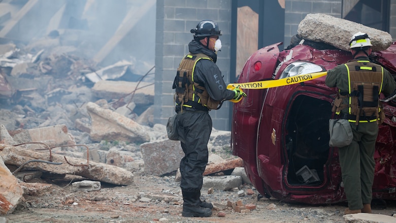 Cpl. Austin Kirby, a Marine with Technical Rescue Platoon, Chemical Biological Incident Response Force, closes off a section of a collapsed building at Guardian Centers in Perry, Georgia, March 23, 2017 during Exercise Scarlet Response 2017.  During a 36-hour field operation, the Marines with CBIRF had to safely extract victims from a collapsed building in the aftermath of a simulated disaster. The field operation is the final event of the exercise.