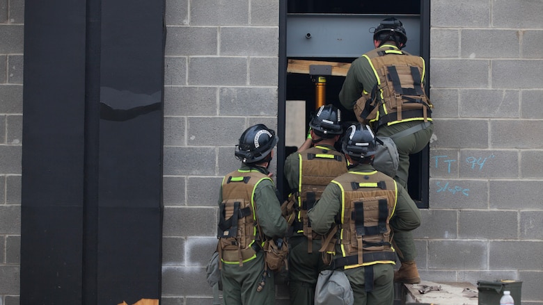 Marines with Technical Rescue Platoon, Chemical Biological Incident Response Force, prop open a pathway into a collapsed building at Guardian Centers in Perry, Georgia, March 23, 2017 during Exercise Scarlet Response 2017.  During a 36-hour field operation, the Marines with CBIRF had to safely extract victims from a collapsed building in the aftermath of a simulated disaster. The field operation is the final event of the exercise.