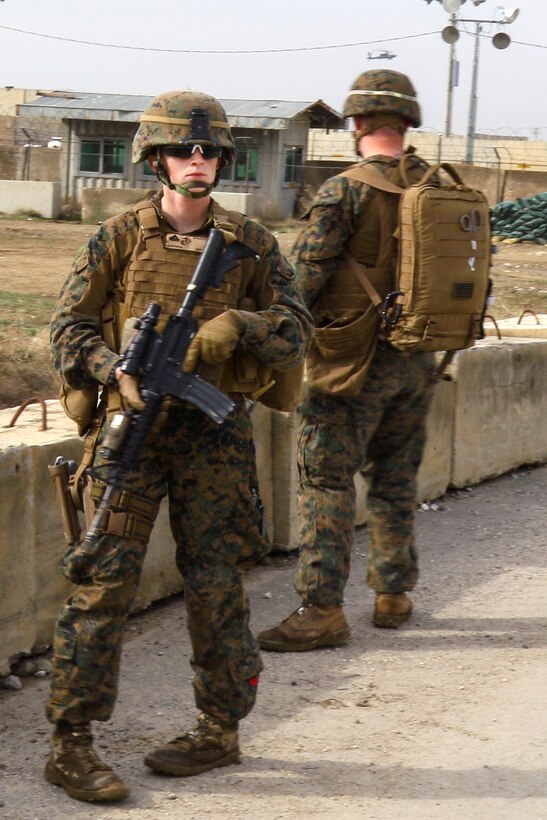 U.S Marine Corps Cpl. Bailey A. Hardiman takes a break while providing security during patrol with Czech and Afghan soldiers near Bagram Airfield, Afghanistan, March 24, 2017. Hardiman is a liaison officer assigned to the Georgian Liaison Team, Rotation Four. Army photo by Sgt. 1st Class LaSonya J. Johnson        