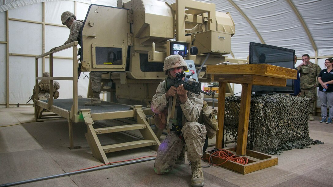 Marines with Combat Logistics Battalion 11, 11th Marine Expeditionary Unit (MEU), posts security around a tactical vehicle rollover simulator during Humvee Egress Assistance Trainer (HEAT) training as part of a sustainment training exercise at Camp Beuhring, Kuwait, Mar. 9. HEAT training stresses the importance of proper gear placement, wearing seat belts, and personnel placement through rehearsal, preventing potential fatalities and reducing injuries sustained in the event of a rollover during combat operations. The 11th MEU is operating in the U.S. 5th Fleet area of responsibility in support of maritime security operations and theater security cooperation efforts to ensure the free flow of commerce, freedom of navigation and regional security. 