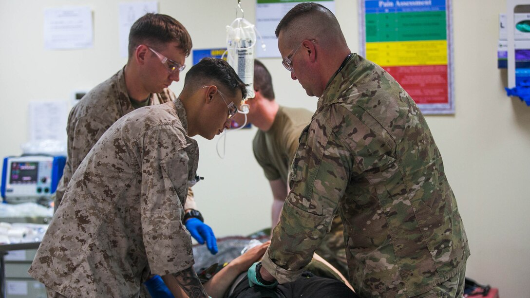 Sailors with 11th Marine Expeditionary Unit (MEU) and soldiers with the 31st Combat Support Hospital, 1st Medical Brigade, assess a simulated casualty during a mass casualty drill as part of a sustainment training (SUSTEX) exercise at Camp Beuhring, Kuwait, Mar. 2. During the training, medical participants identified physical and mental trauma to arrange patient care into categories based on severity of injuries sustained. Through the training conducted at SUSTEX, Marines and Sailors with the 11th MEU remain postured to respond to emerging crises, from conducting humanitarian assistance to providing medical aid to casualties in theater. 