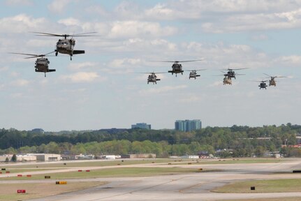 A formation of Georgia Army National Guard helicopters arrives at the Clay National Guard Center in Marietta, Ga. following Vigilant Guard 17.