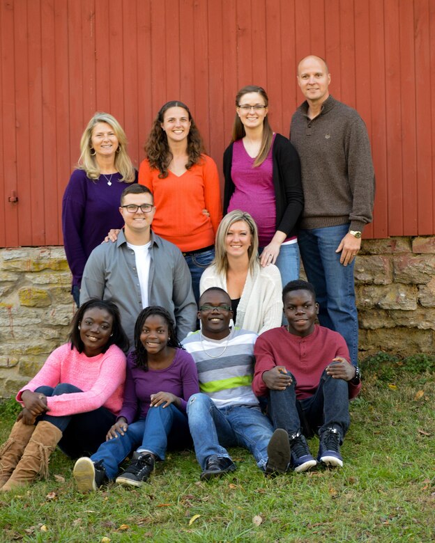 Master Sgt. Frank Williams, a reservist with the 445th Aerospace Medicine Squadron, poses with his family. Williams and his wife, Kim, adopted four children from Africa to become a family of 10.