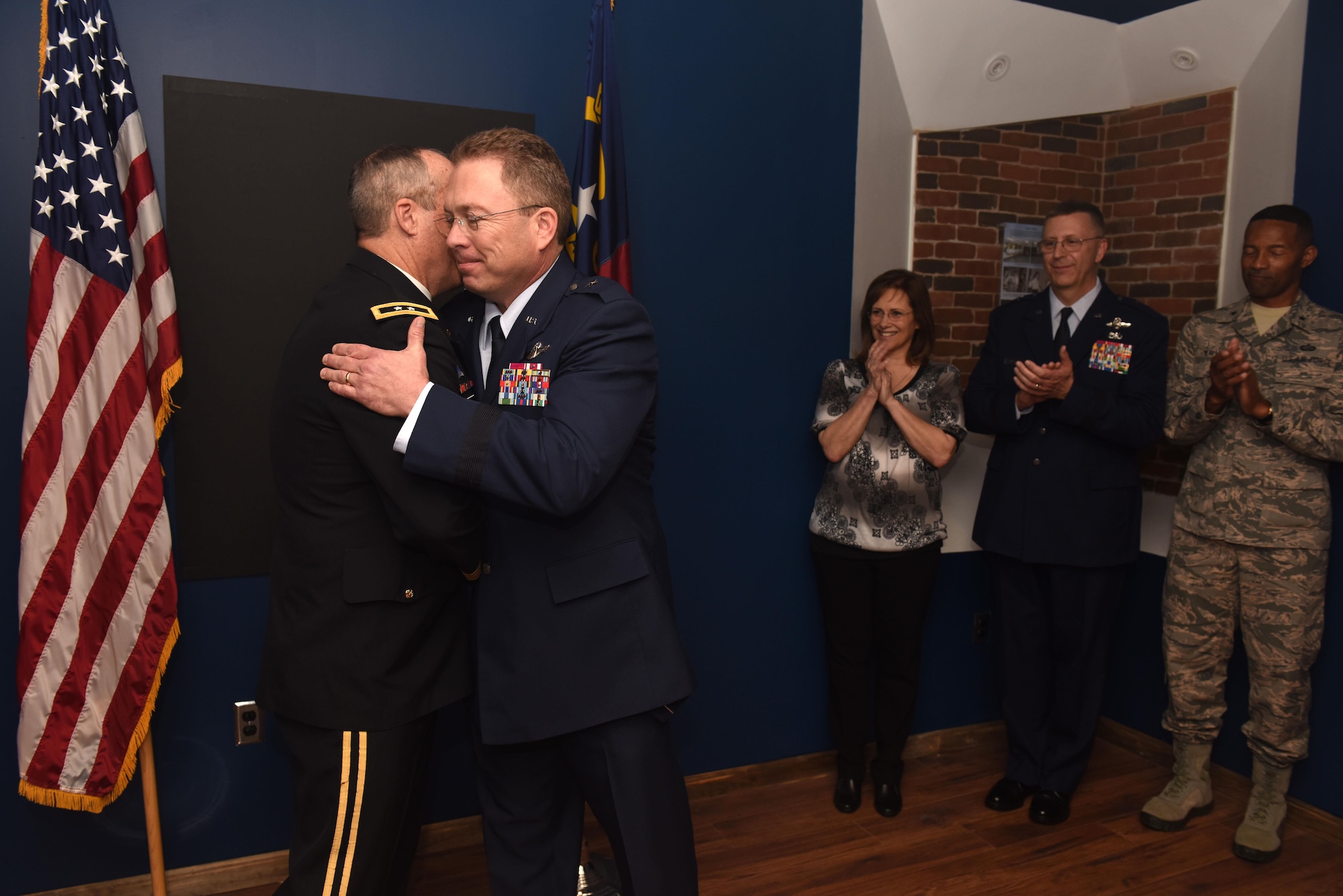 U.S. Army Maj. Gen. Gregory A. Lusk (left), the Adjutant General of North Carolina, commander of the North Carolina National Guard NCNG, congratulates U.S. Air Force Brig. Gen. Thomas J. Kennett (center), the Assistant Adjutant General, Air for the NCNG during an Oath of Office ceremony held at the North Carolina Air National Guard Base, Charlotte Douglas International Airport, April 1, 2017. Kennett joins the NCNG after having served as the Chief of Staff, Air at the Tennessee National Guard and as the airborne emergency action officer for the U.S. strategic command. (U.S. Air National Guard photo by Staff. Sgt. Laura J. Montgomery)