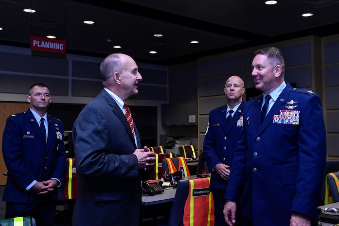 Col. Rob Lyman, right, Joint Base Charleston commander, meets with J. Al Cannon, left, Charleston County sheriff, during a tour of the Charleston County Consolidated 911 Center, March 30, 2017. The Enhanced 911 initiative combines the call centers for the 628th Security Forces Squadron and fire department with the Charleston County Consolidated 911 Center, ultimately shortening response times, saving money and saving lives.