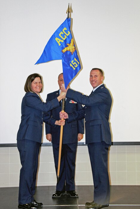 Col. Kristin Streukens, 151st Air Refueling Wing Commander, hands the 151st Intelligence, Surveillance and Reconnaissance Group guidon to Lt. Col. Darrin Ray, 151st ISRG Commander, during the unit stand up ceremony on March 4, 2017 at the Roland R. Wright Air National Guard Base in Salt Lake City. (U.S. Air National Guard photo by Staff Sgt. Nathan Cragun)
